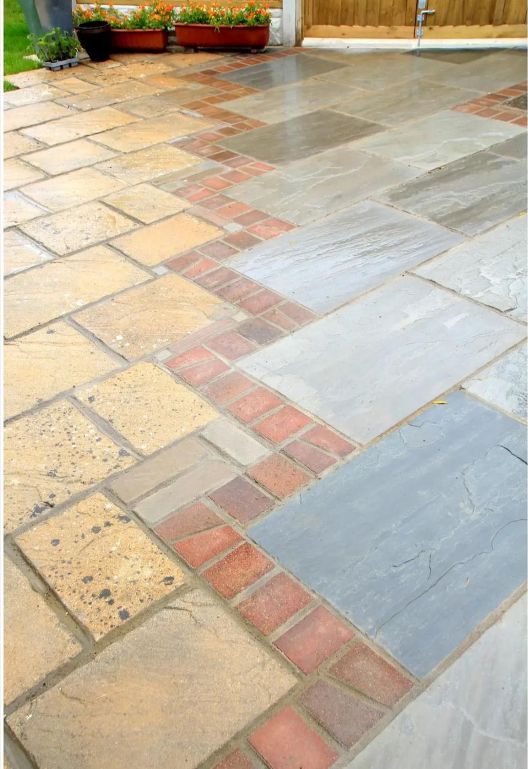 Brick band between buff sandstone and grey slate