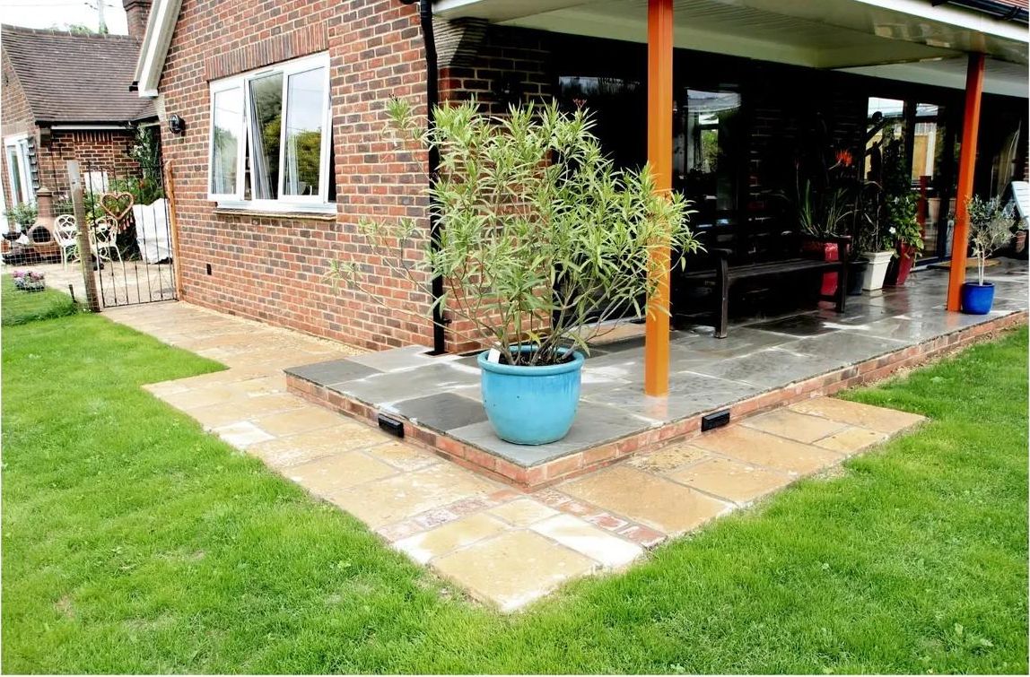 Raised slate step up to the covered doors